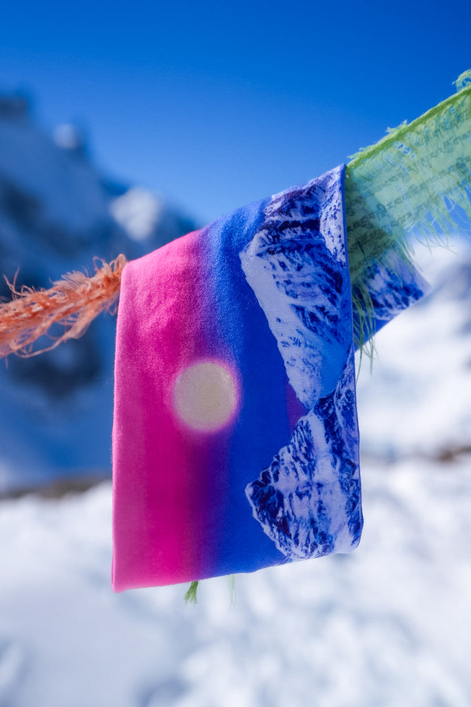 Arctic Moonrise headband  hanging on flags with a snowy backdrop